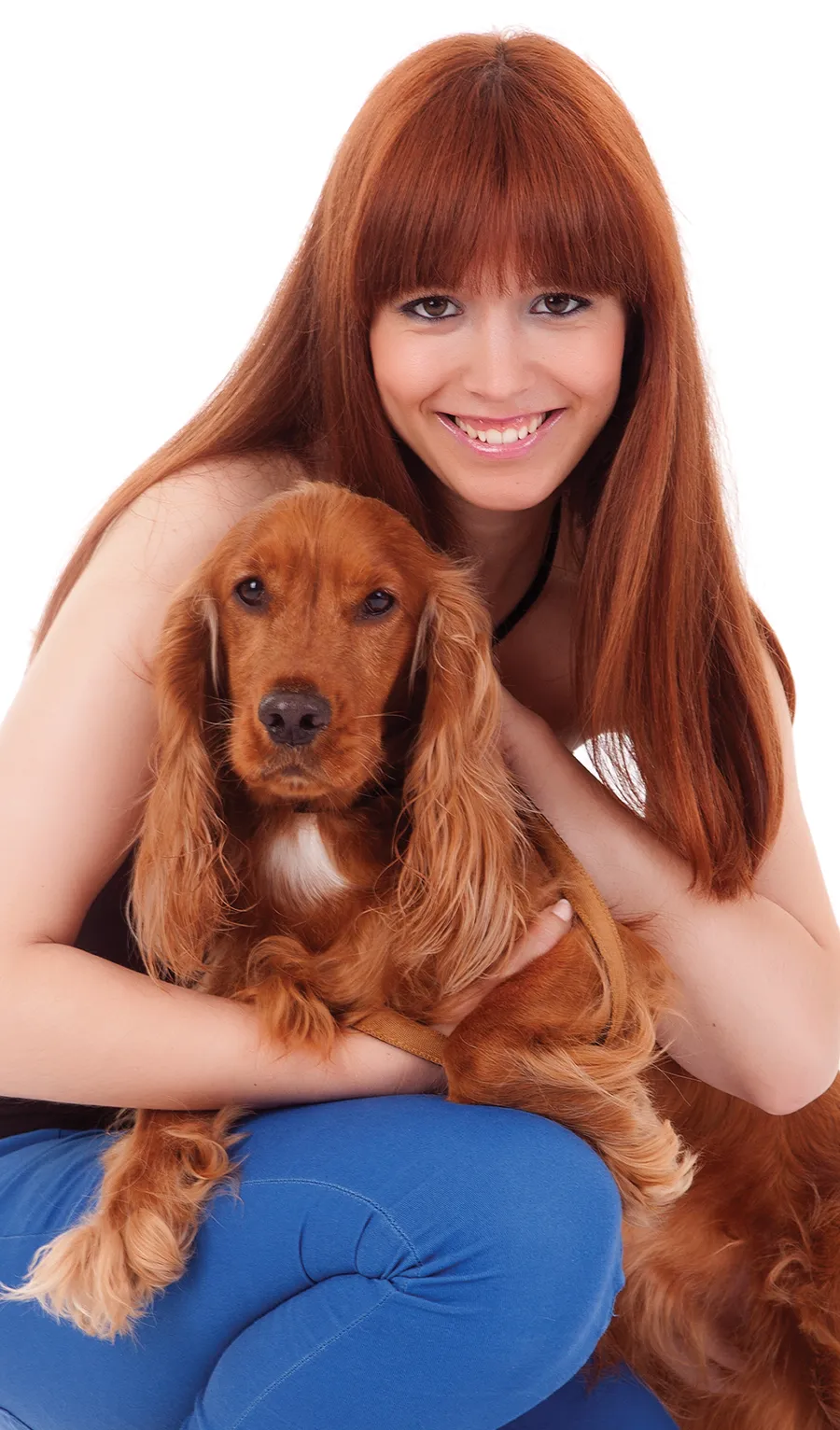 girl holding a dog